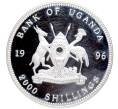 Монета 2000 шиллингов 1996 года Уганда «Знаменитые места мира — Памятник Вильгельму Теллю в Альтдорфе (Шваейцария)» (Артикул K27-81239)