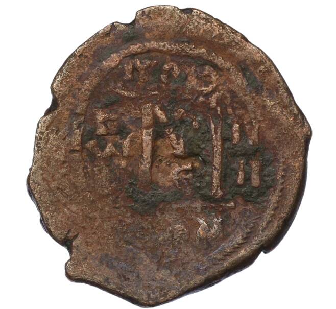 Монета Фоллис 610-641 года Византия — Ираклий I (Перечекан из 1/2 фоллиса Юстиниана I) (Артикул: T11-19267) — Фото №2