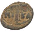 Монета Фоллис 498-1042 года Византия (Артикул: M2-92105) — Фото №2
